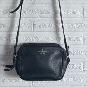 Kate Spade small black crossbody with dual zippers.